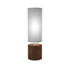 Table lamp with wooden base and white cylindrical shade on a light gray background